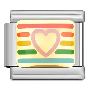 Close-up of stainless steel modular charm with enamel heart and rainbow pattern
