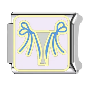 Close-up of an Italian charm link with a stylized light blue bikini swimwear pattern design