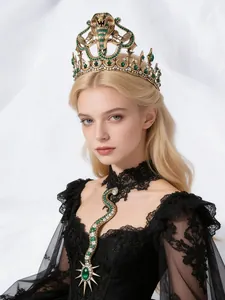 Detailed view of an elegant gold snake crown and emerald jewelry on a fashion model.