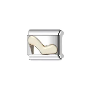 Close-up of silver modular Italian charm link with a glittery cream high-heeled shoe design