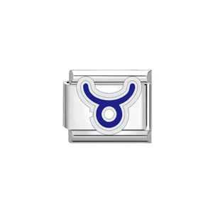 Macro detail of blue enamel Taurus zodiac symbol on stainless steel Italian charm link