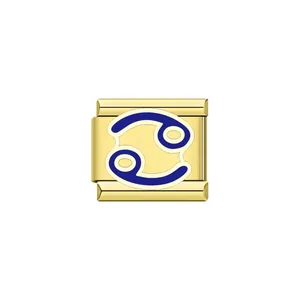 Macro view of golden stainless steel Italian charm featuring a blue enamel Cancer zodiac sign