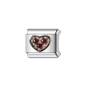Detailed macro view of heart charm with three red gemstones for DIY modular bracelet