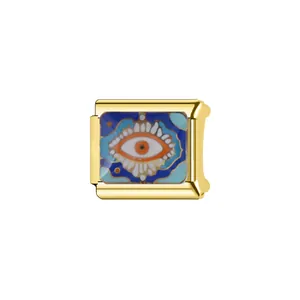 Close-up of a gold Italian charm link featuring an enamel evil eye design for DIY bracelets.