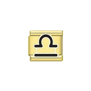 Detailed view of gold Italian charm link with black enamel Libra zodiac symbol.