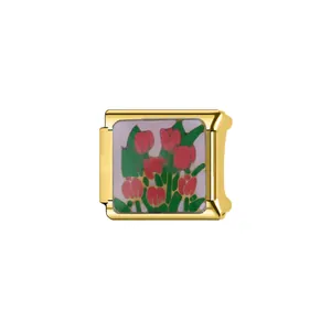 Close-up of a gold Italian charm link featuring a vibrant red tulip floral pattern