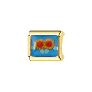 Detailed view of golden stainless steel Italian charm with blue cartoon owl design