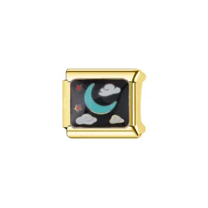Close-up of a gold-plated stainless steel Italian modular charm with moon and cloud enamel