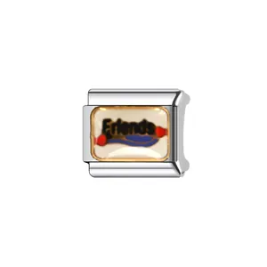 Detail of silver modular bracelet charm featuring 'Friends' text and colorful enamel