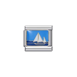 Detailed macro view of a blue enamel sailboat charm for Italian modular bracelets