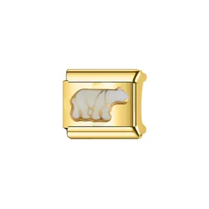 Detail of gold Italian modular charm with white enamel polar bear design