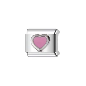 Detailed macro view of a stainless steel Italian modular charm with a pink enamel heart