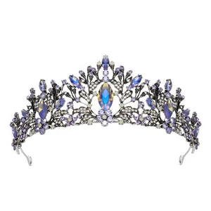 Detailed view of an elegant purple crystal bridal tiara with iridescent blue stones.