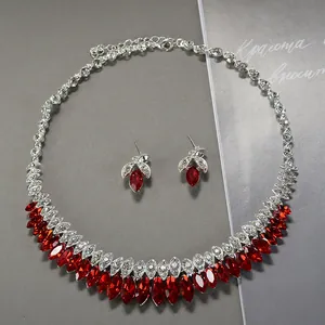 Luxurious bridal jewelry set with sparkling red crystals and silver necklace earrings