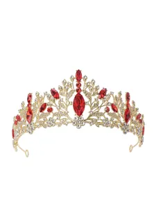 Exquisite close-up of a gold bridal tiara crown featuring vibrant red and clear crystals
