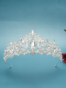Detailed view of silver crystal bridal tiara with intricate marquise rhinestone patterns