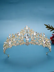 Macro view of an elegant golden bridal tiara encrusted with clear crystals for weddings