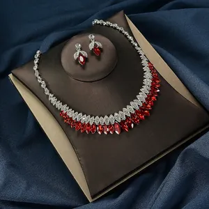 Luxurious bridal jewelry set featuring red marquise-cut crystals and a silver-tone setting.