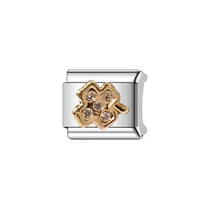 Detailed view of Italian style modular charm with gold-plated four-leaf clover and crystals