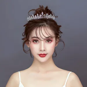 Elegant bridal silver rhinestone tiara shown on a model with wedding hairstyle