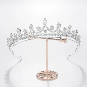 Detailed close-up of a silver bridal crown tiara with sparkling white rhinestones
