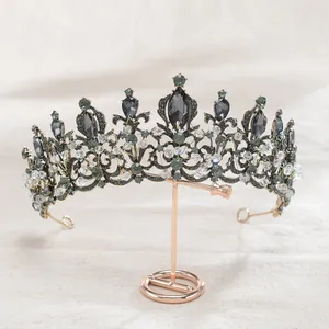 Detailed macro view of a vintage baroque style black crystal crown for bridal hair accessories