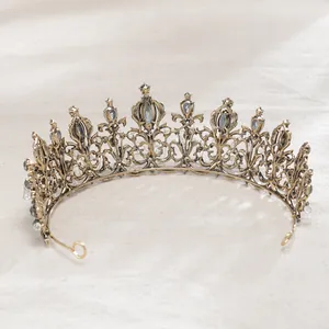 Detailed view of intricate vintage Baroque black bridal tiara with grey crystals