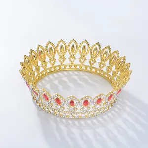 Detailed close-up of a Baroque circular bridal crown with gold plating and red gemstones