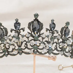 Detailed macro view of an intricate vintage black Baroque bridal crown with crystals.