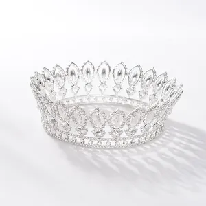 Detailed view of a baroque style silver bridal crown with intricate crystal rhinestones.