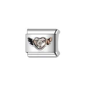 Detailed close-up view of a silver Italian modular charm link with winged heart and crystal