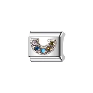 Detail view of a stainless steel Italian charm link with vibrant multi-color stones.