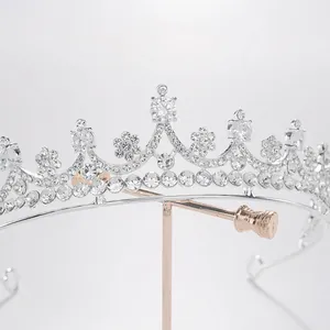 Macro detail of a silver bridal tiara encrusted with shimmering clear rhinestones