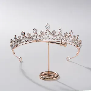 Elegant rose gold bridal tiara crown with sparkling crystals for wedding hair styling.