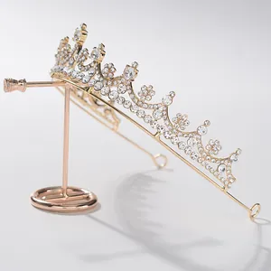 Close-up of elegant gold bridal tiara with sparkling rhinestones on display