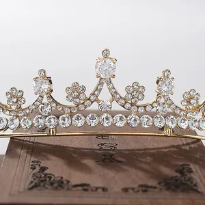 Detailed view of an elegant bridal crown with sparkling clear rhinestones on gold base