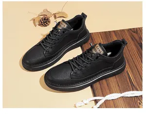 Close-up detail of men's black leather casual sneakers featuring durable soft rubber soles