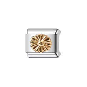 Detailed view of a silver stainless steel Italian charm link with gold floral daisy motif