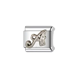 Detailed macro view of a silver Italian charm featuring a crystal-studded letter A.