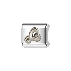 Close-up of silver Italian modular charm link with a stylized symbol and small stone.