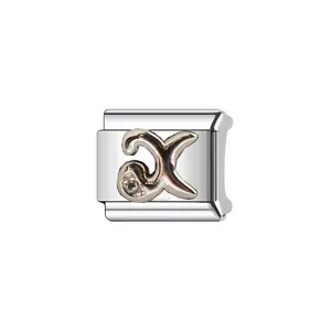 Close-up of stainless steel Italian charm link featuring a stylized letter X with crystal.