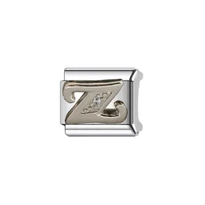 Macro view of a silver stainless steel Italian charm link featuring a sparkling letter Z