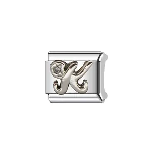 Macro view of a silver stainless steel Italian modular charm featuring letter K
