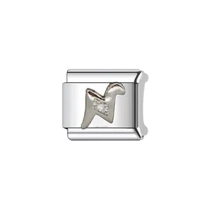 Close-up of a silver stainless steel Italian modular bracelet charm with crystal inlay