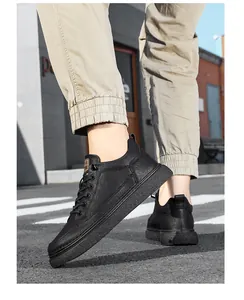 Close-up of stylish black leather sneakers for men worn in an urban street setting