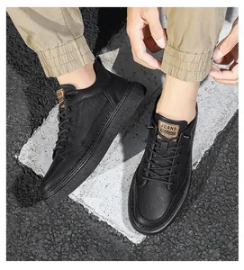 Detailed view of men's black leather casual shoes featuring a lace-up design and textured finish