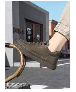 Men's stylish brown leather sneakers with thick textured sole shown in urban setting