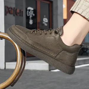 Stylish men's brown leather casual sneakers featuring soft sole and classic lace-up design