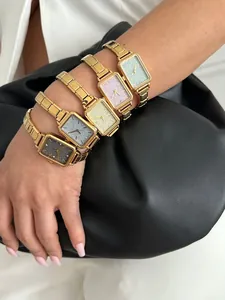 Elegant women's rectangular quartz watches with glitter dials and gold bands.