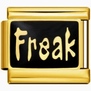 Macro view of gold stainless steel modular charm with black enamel and Freak design